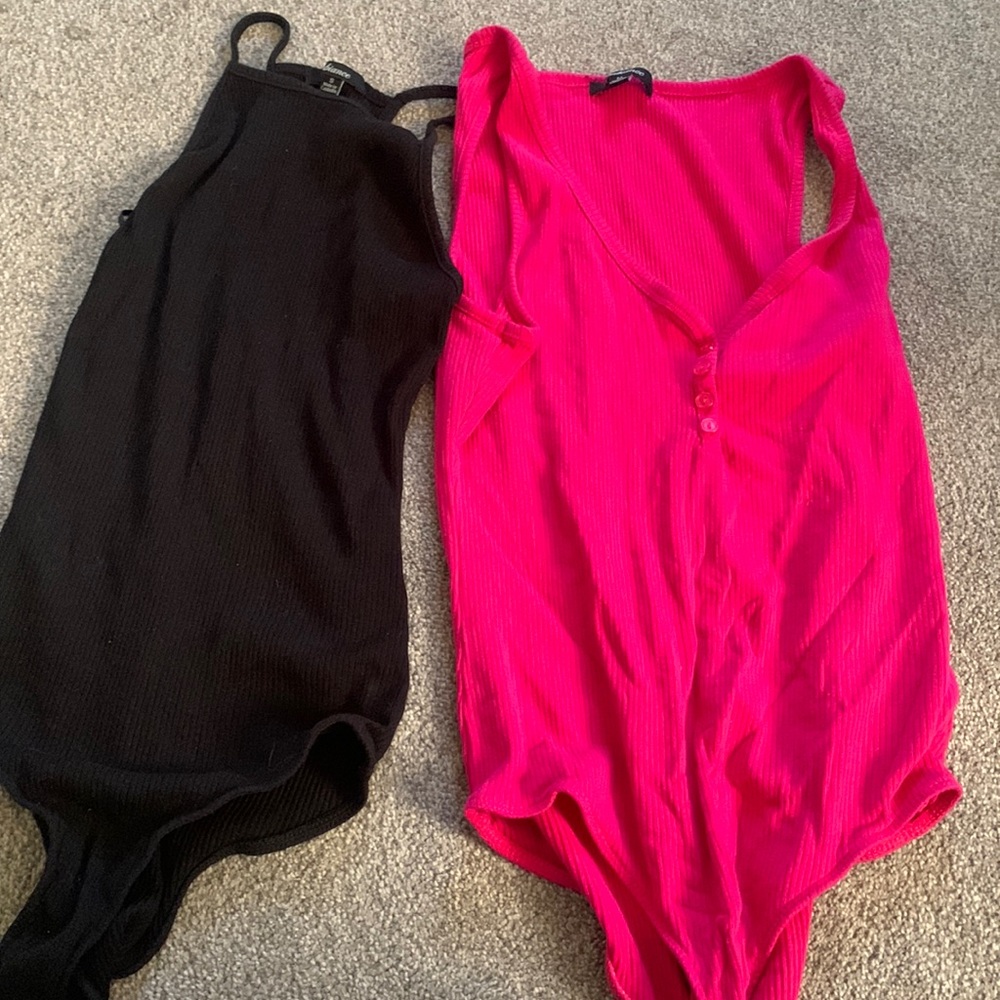 pink and black body suits